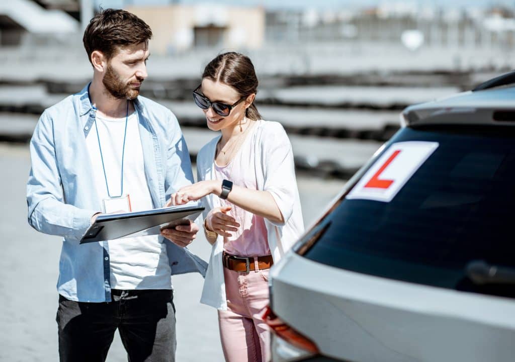 instructor-with-female-student-at-the-driving-school-outdooors-1.jpg